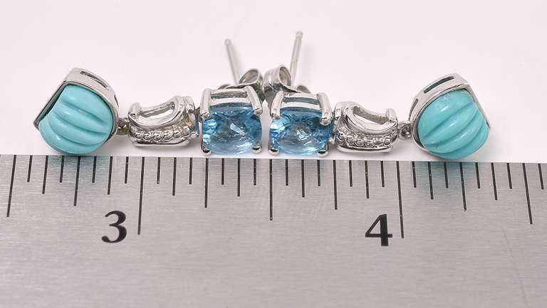 Blue Topaz Dangle Earrings In Sterling Silver