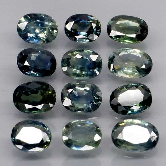 Heated only! 3.98ct blue green sapphire set