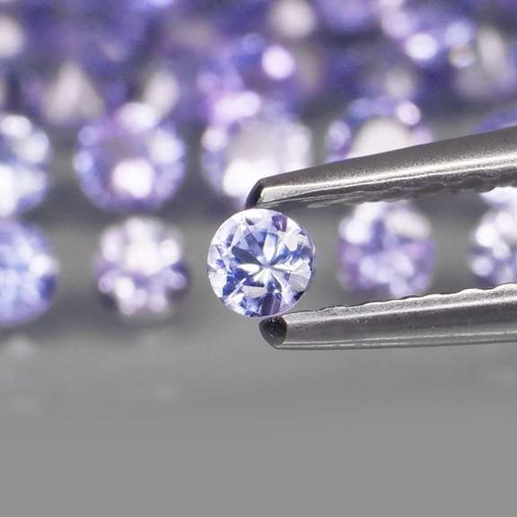Heavy flashing 3.32ct diamond cut Tanzanite set
