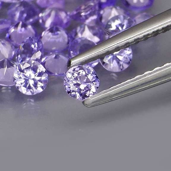 Heavy flashing 4.44ct diamond cut Tanzanite set