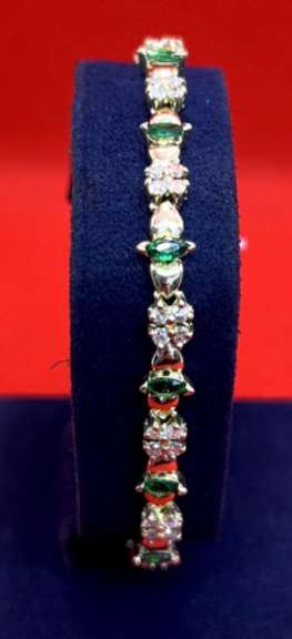LADIES 14K YELLOW GOLD DIAMOND AND EMERALD BRACELET 