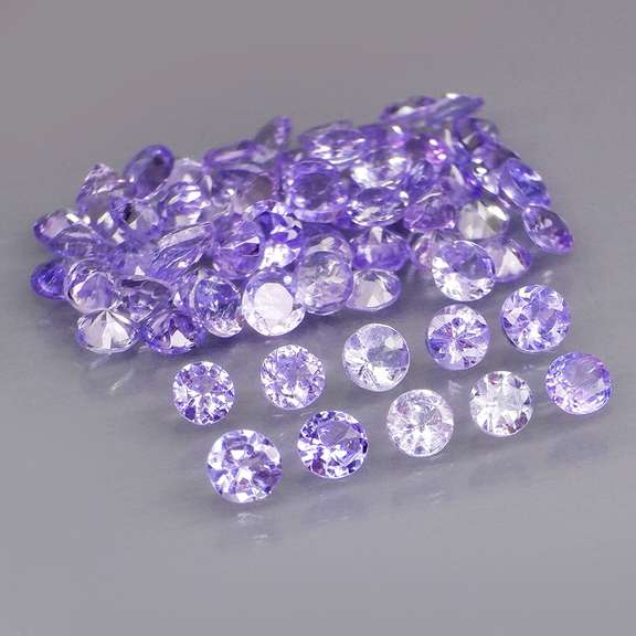 Heavy flashing 4.57ct diamond cut Tanzanite set