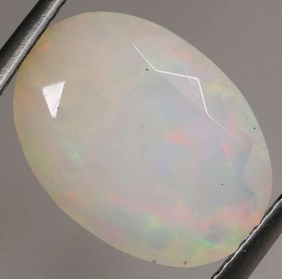 Smoldering flashing 2.97ct faceted Opal