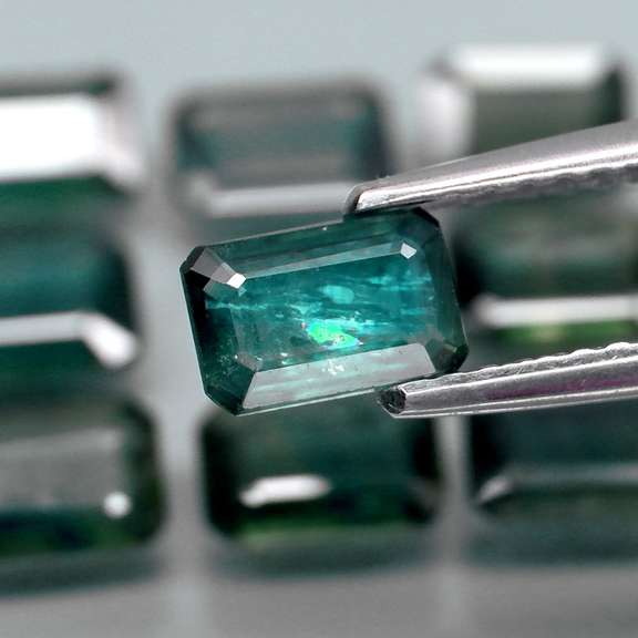 Heated only! 5.32ct blue green sapphire set