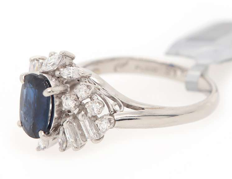 Festive Platinum Oval Blue Sapphire and Mixed Diamonds Frame Ring
