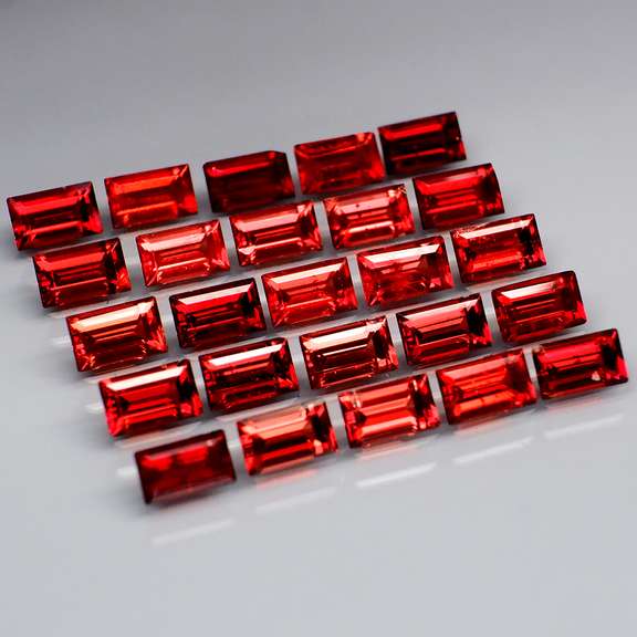 Nice 8.13ct emerald cut cherry red Garnet set