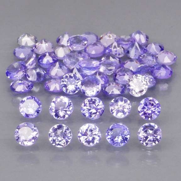 Heavy flashing 4.07ct diamond cut Tanzanite set