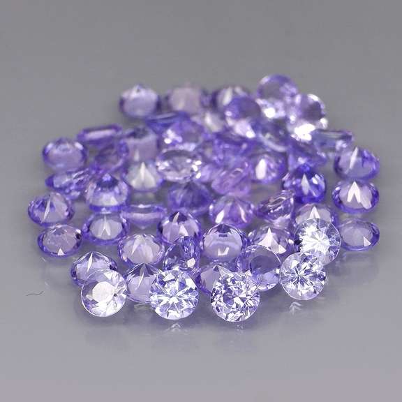 Heavy flashing 4.48ct diamond cut Tanzanite set