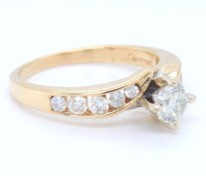 Elegant Round Brilliant Cut and Channel Set Diamond Engagement Ring in Yellow Gold