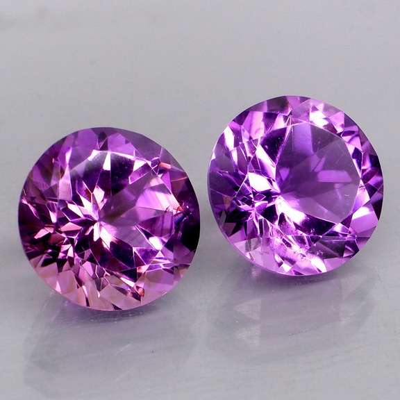 Glittering 6.99ct violet Amethyst solitaire pair