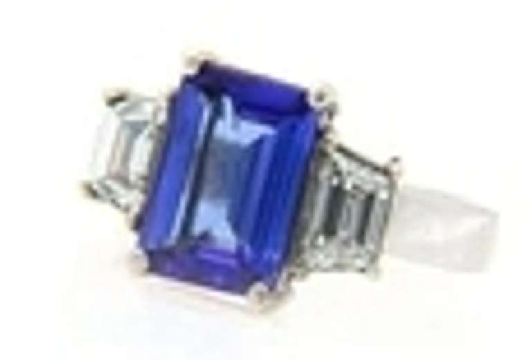 Quintessential Emerald Cut Tanzanite and Trapezoid Diamond Ring