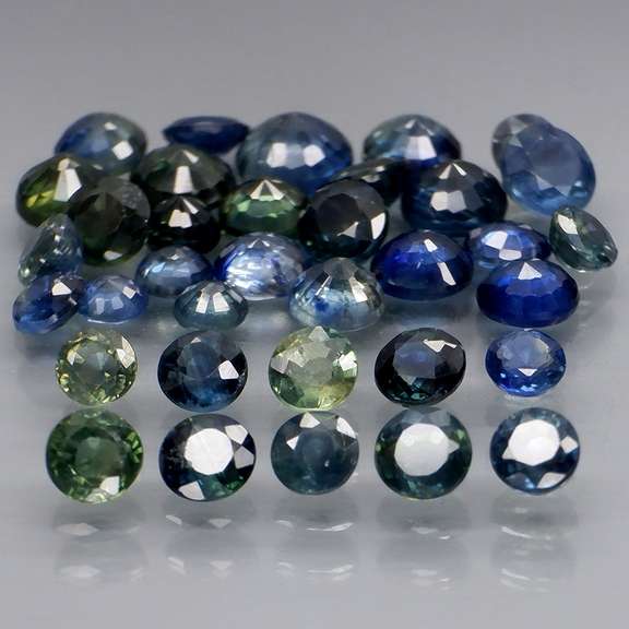 Heated only! 7.24ct blue green Sapphire set