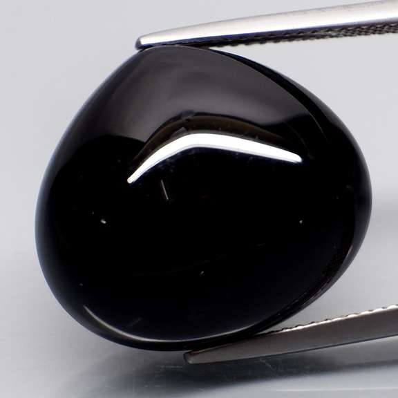 Elegant 24.26ct silky black Loas Tektite cabochon