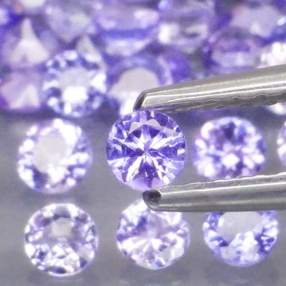 Heavy flashing 4.07ct diamond cut Tanzanite set