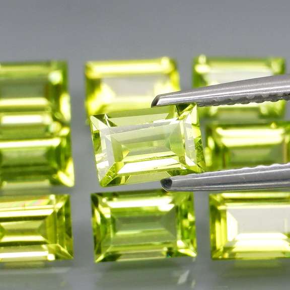 Brilliant 5.95ct 9pc set of matched baguette cut Peridot