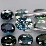 Heated only! 3.98ct blue green sapphire set