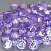 Heavy flashing 4.44ct diamond cut Tanzanite set