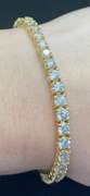 STUNNING 7.50 CARATS T.W. ROUND BRILLIANT CUT DIAMOND TENNIS BRACELET IN 14K YELLOW GOLD