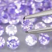 Heavy flashing 4.57ct diamond cut Tanzanite set