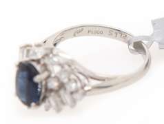 Festive Platinum Oval Blue Sapphire and Mixed Diamonds Frame Ring