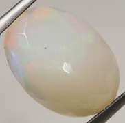 Smoldering flashing 2.97ct faceted Opal