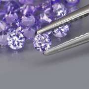 Heavy flashing 4.48ct diamond cut Tanzanite set