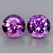 Glittering 6.99ct violet Amethyst solitaire pair
