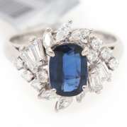 Festive Platinum Oval Blue Sapphire and Mixed Diamonds Frame Ring