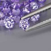 Heavy flashing 4.44ct diamond cut Tanzanite set