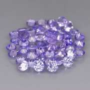 Heavy flashing 4.48ct diamond cut Tanzanite set
