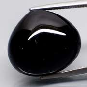 Elegant 24.26ct silky black Loas Tektite cabochon