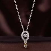 Two tone oval sterling silver and dancing stone pendant