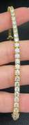 STUNNING 7.50 CARATS T.W. ROUND BRILLIANT CUT DIAMOND TENNIS BRACELET IN 14K YELLOW GOLD