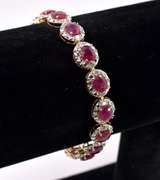 Stunning 8.55CTW Oval Cut Ruby Bracelet & 1.21CTW Diamond in Gold Plated Sterling Silver