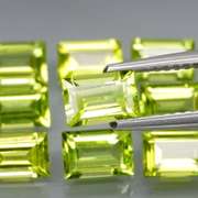 Brilliant 5.95ct 9pc set of matched baguette cut Peridot