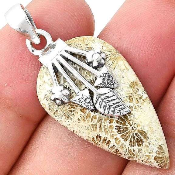 Ornate 24.50ct Coral Fossil pendant