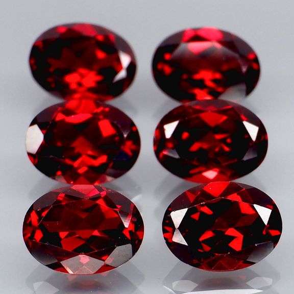 Amazing 9.10ct oval cut cherry red Garnet set