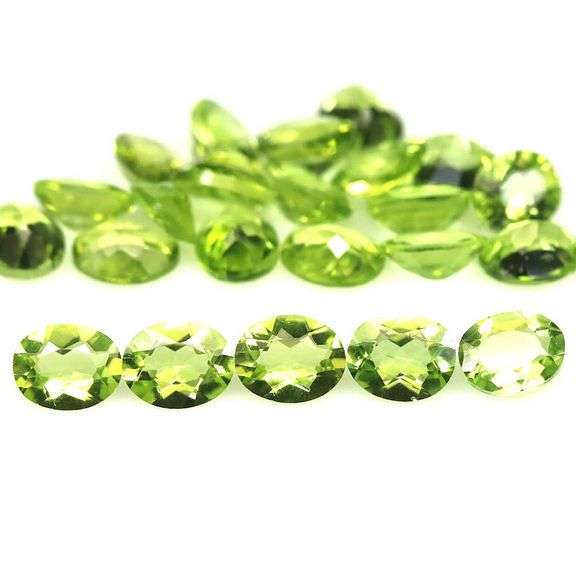 Fantastic 8.42ct 5x4mm oval cut Peridot set