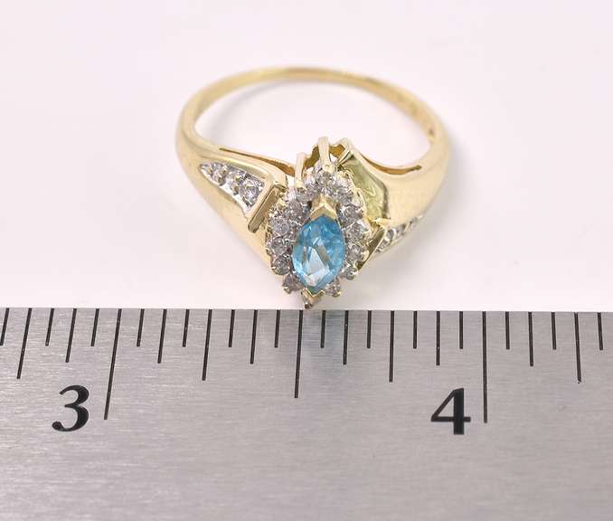 Elegant Blue Topaz And Diamond Ring In 14K Yellow Gold