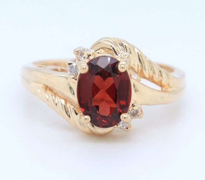 Handsome Yellow Gold oval Garnet and Diamond Ring