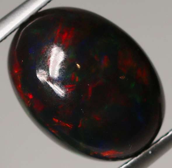 Block flashing 3.12ct black Opal cabochon