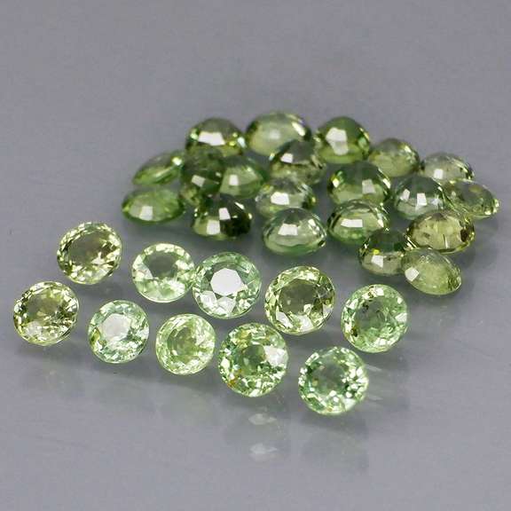Fantastic 6.47ct diamond cut GREEN Sapphire set