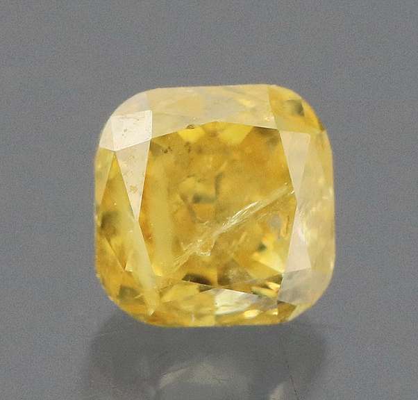 Gorgeous .26ct emerald cut yellow Diamond
