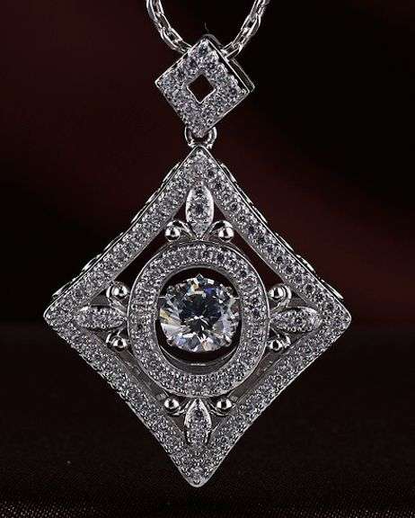 Beautiful platinum over 925 non tarnish sterling with center stone dancing pendant