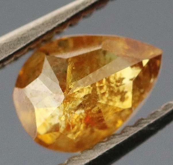 One of a kind! .33ct amber Diamond