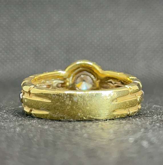 TWO TONE BEZEL SET ROUND DIAMOND ENGAGEMENT RING IN 18K YELLOW GOLD (0.65 C.T. T.W.)