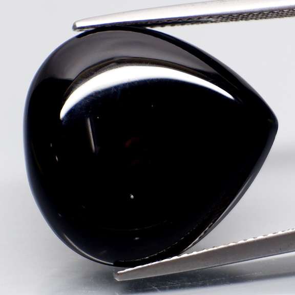 Elegant 23.12ct silky black Tektite cabochon