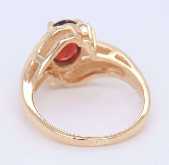 Handsome Yellow Gold oval Garnet and Diamond Ring