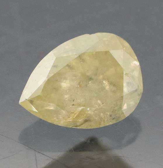 Bright .33ct pear cut yellow Diamond
