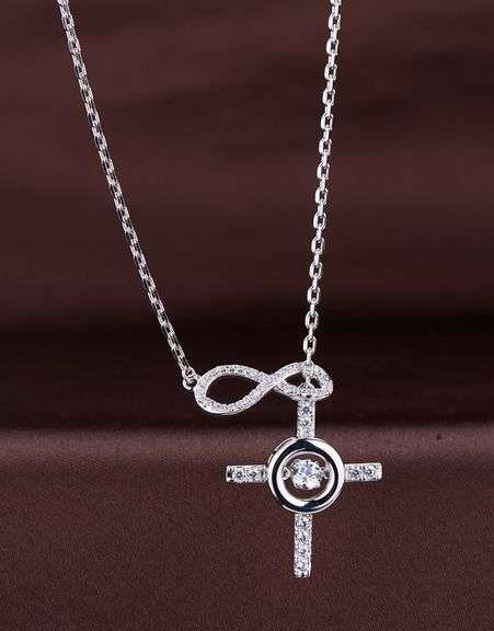 Beautiful Platinum over non tarnish Sterling silver infinity with cross pendant
